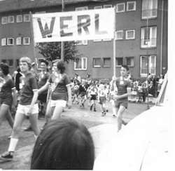 Early 60s - Walking through the Werl PMQs sports day, Ron Wilkins & friend holding Werl banner